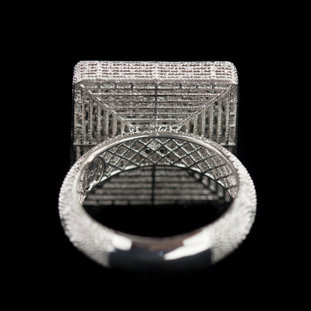 Finely worked out square ring of silver