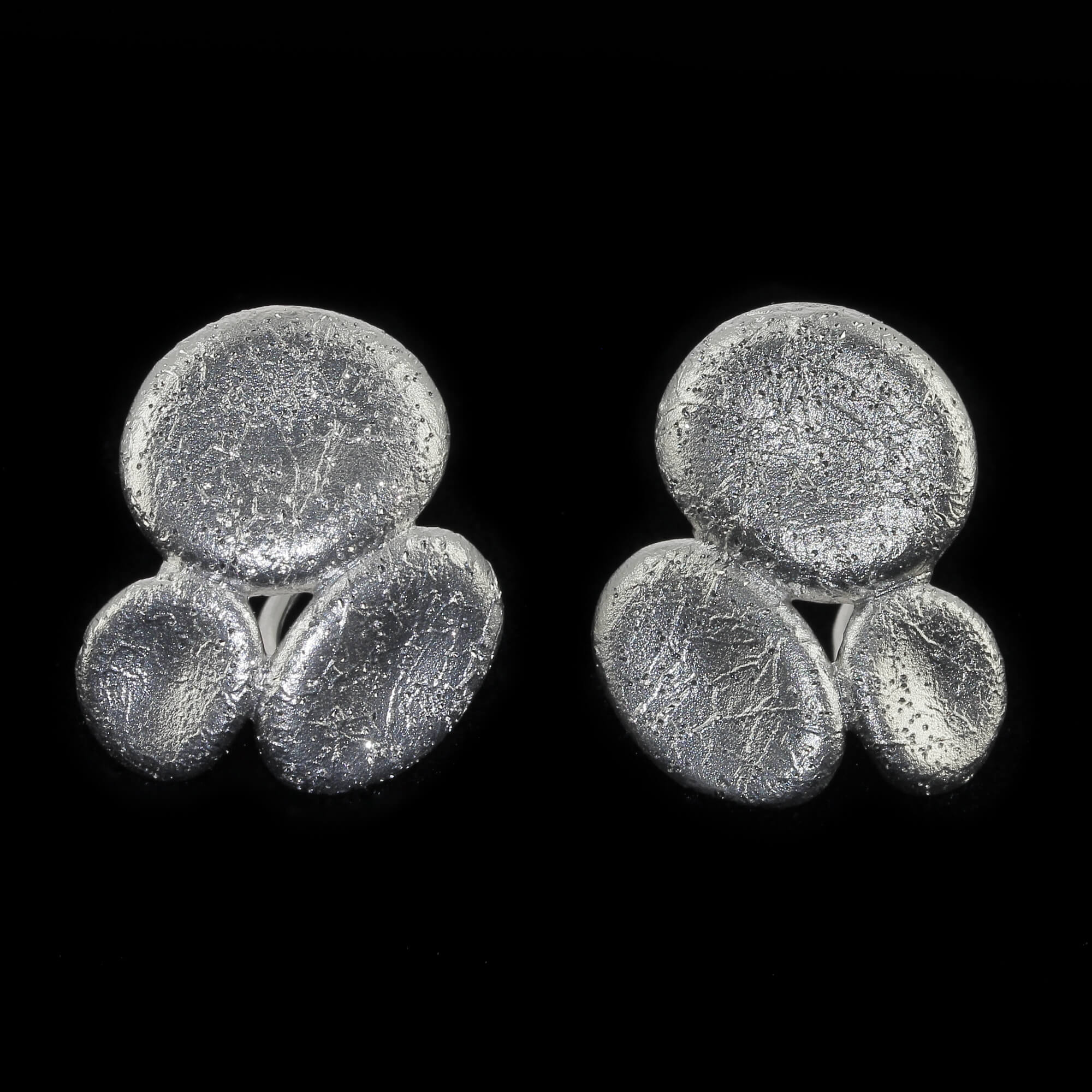 Silver oval-shaped earrings. diamond