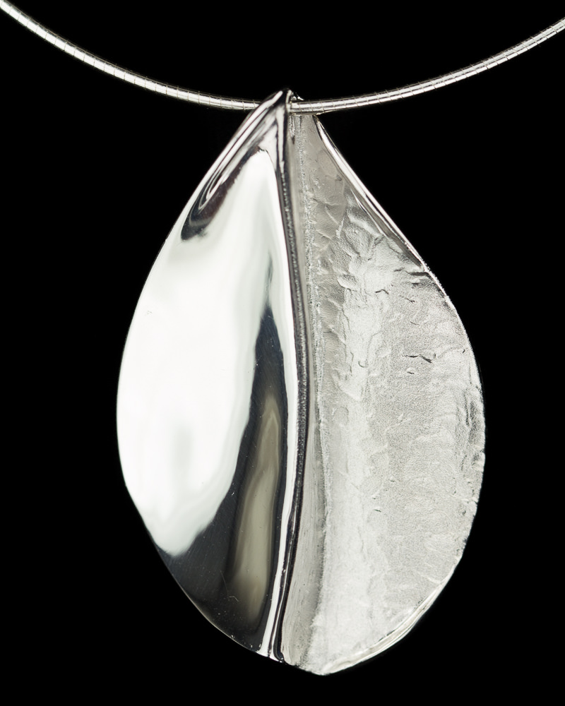 Polished silver pendant without chain