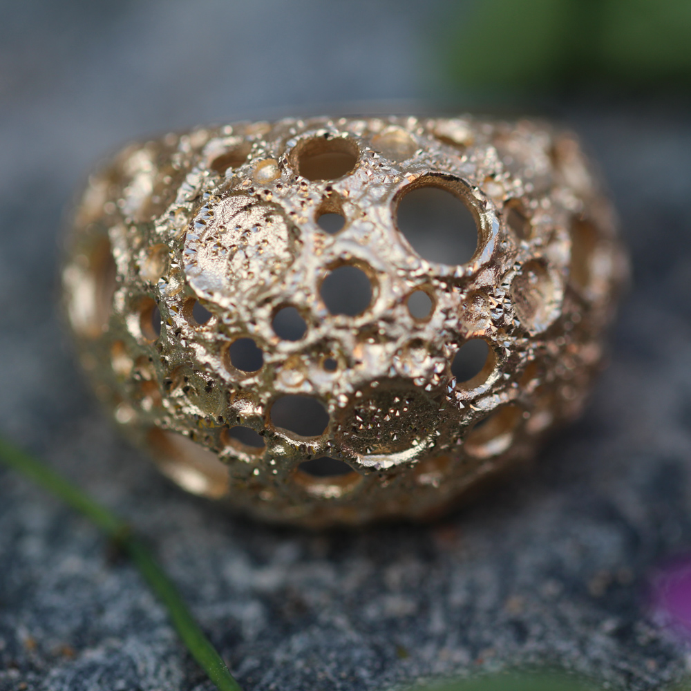 Processed and gold-plated spherical ring