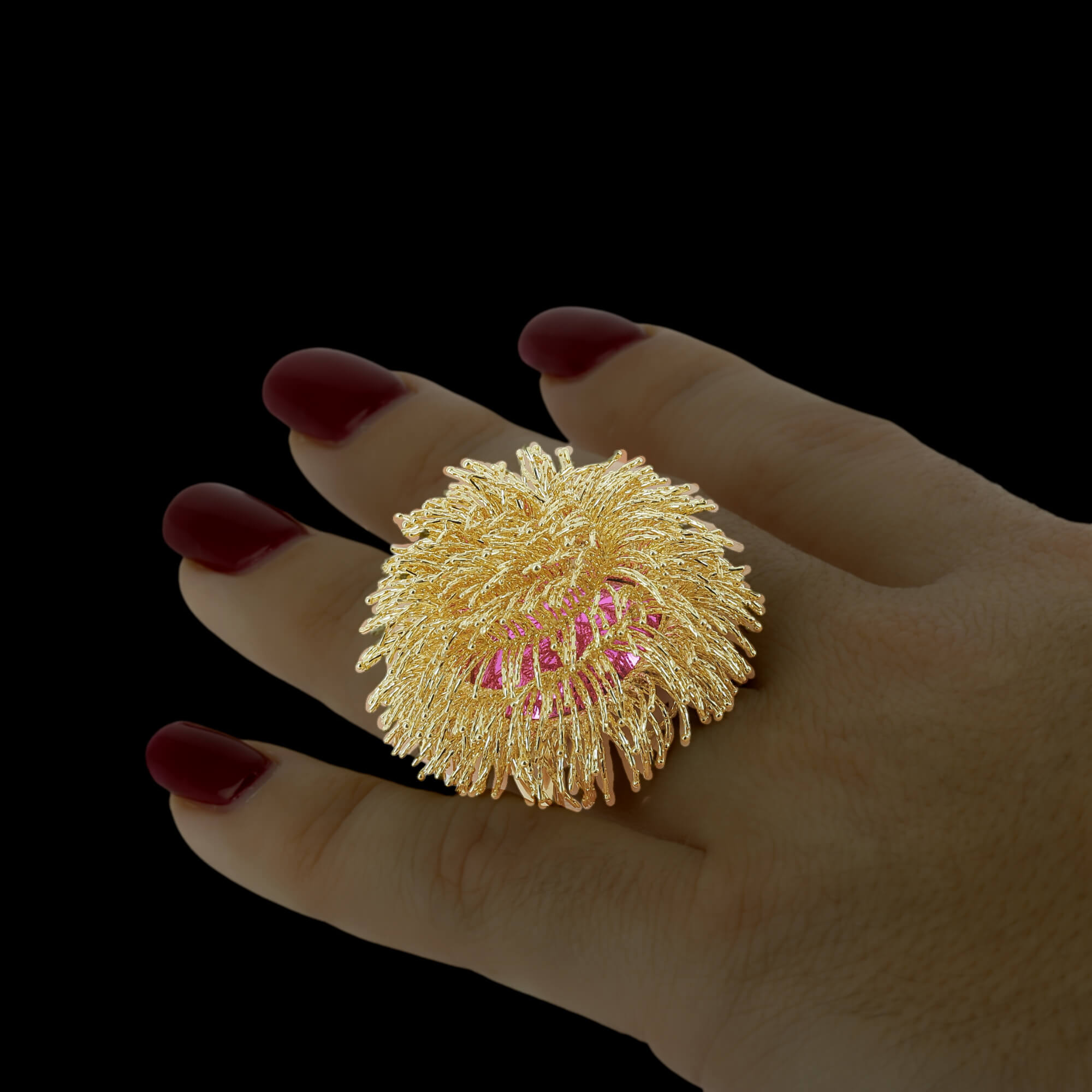 A large 18kt gold ring with fringes