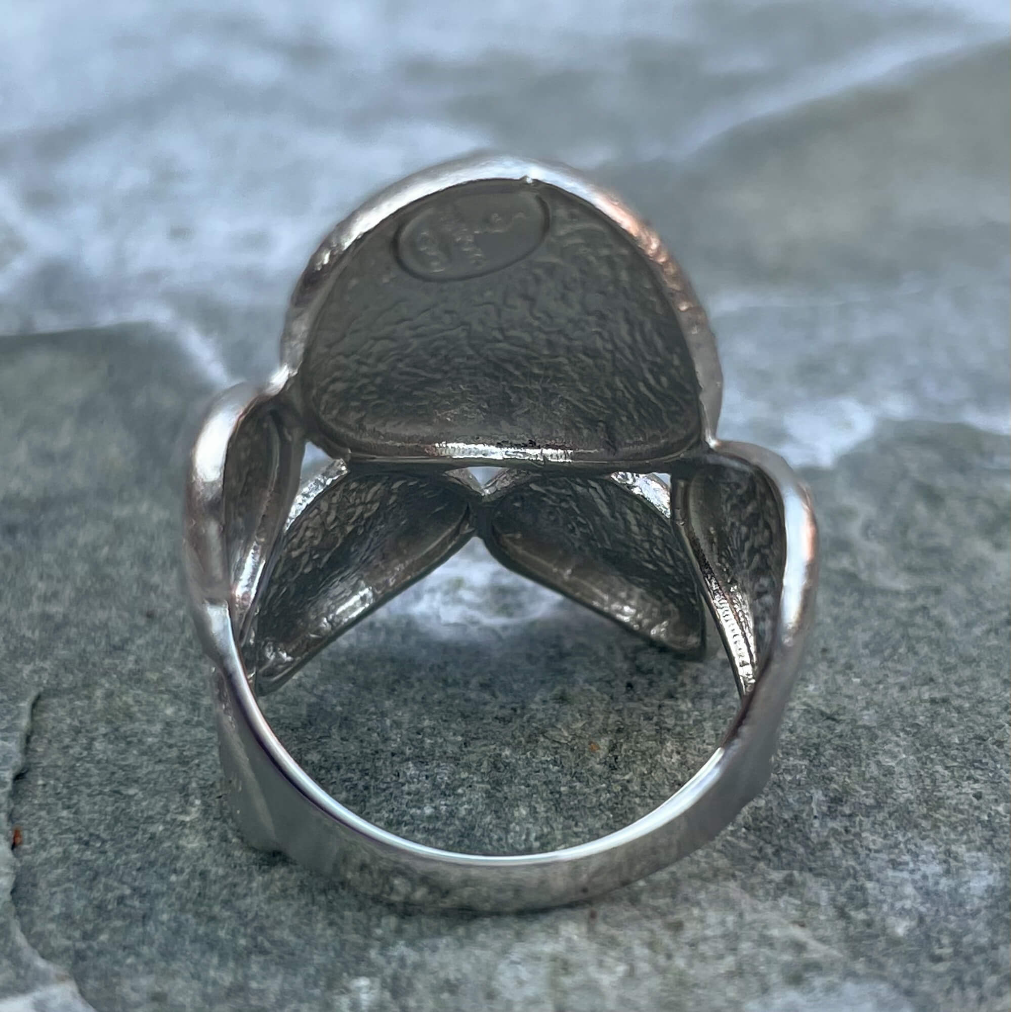 Silver ring with oval-shaped operations