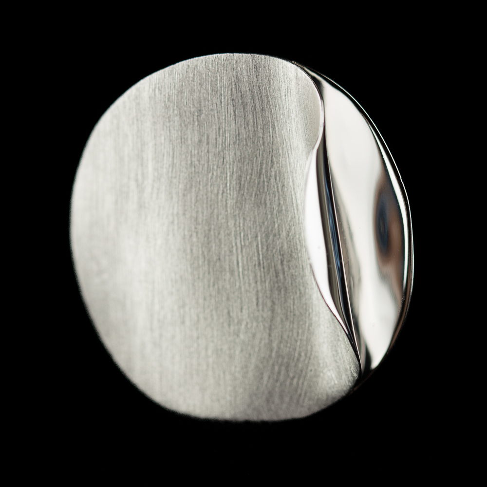 Silver circular ring with polished curl