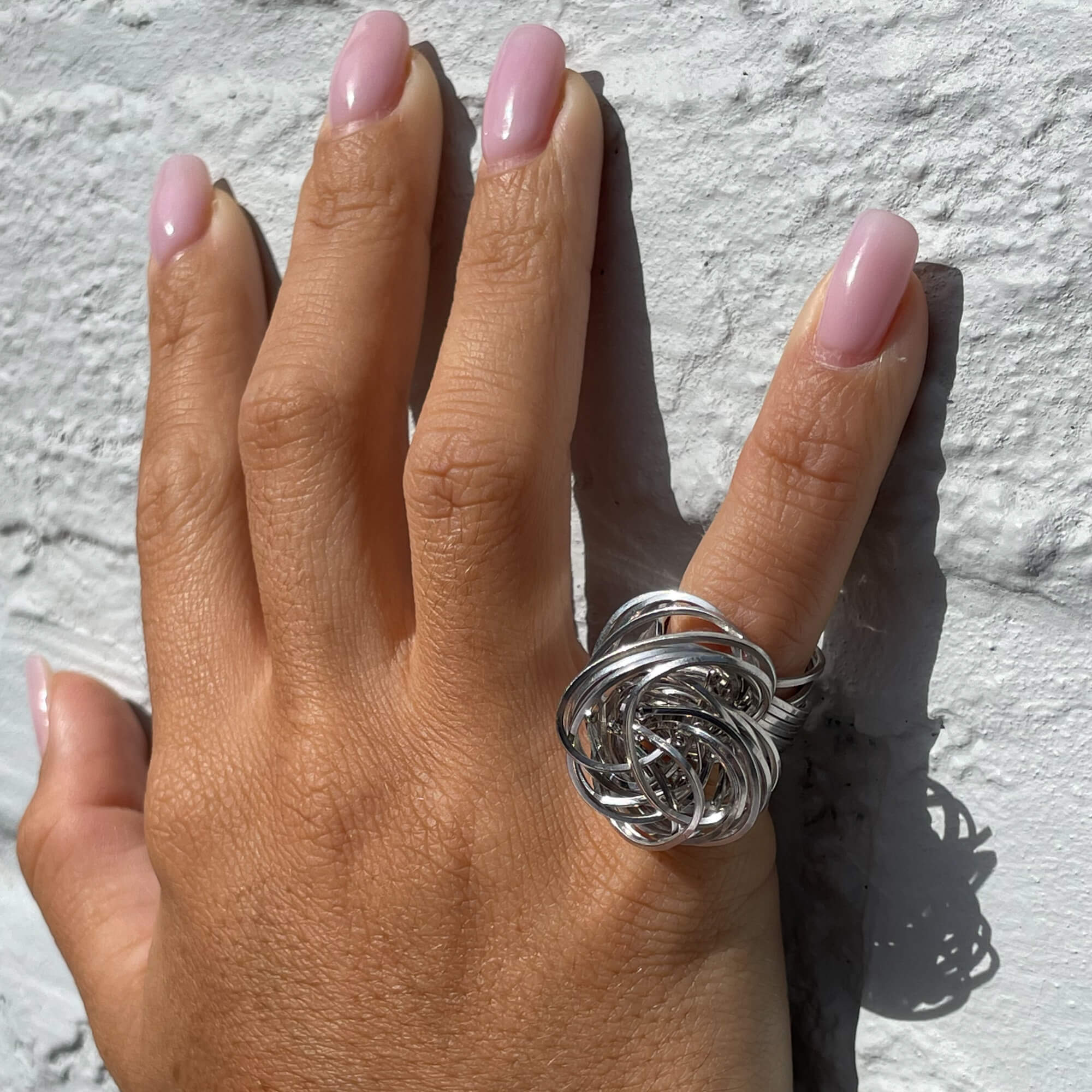 Multi-strand silver curl ring