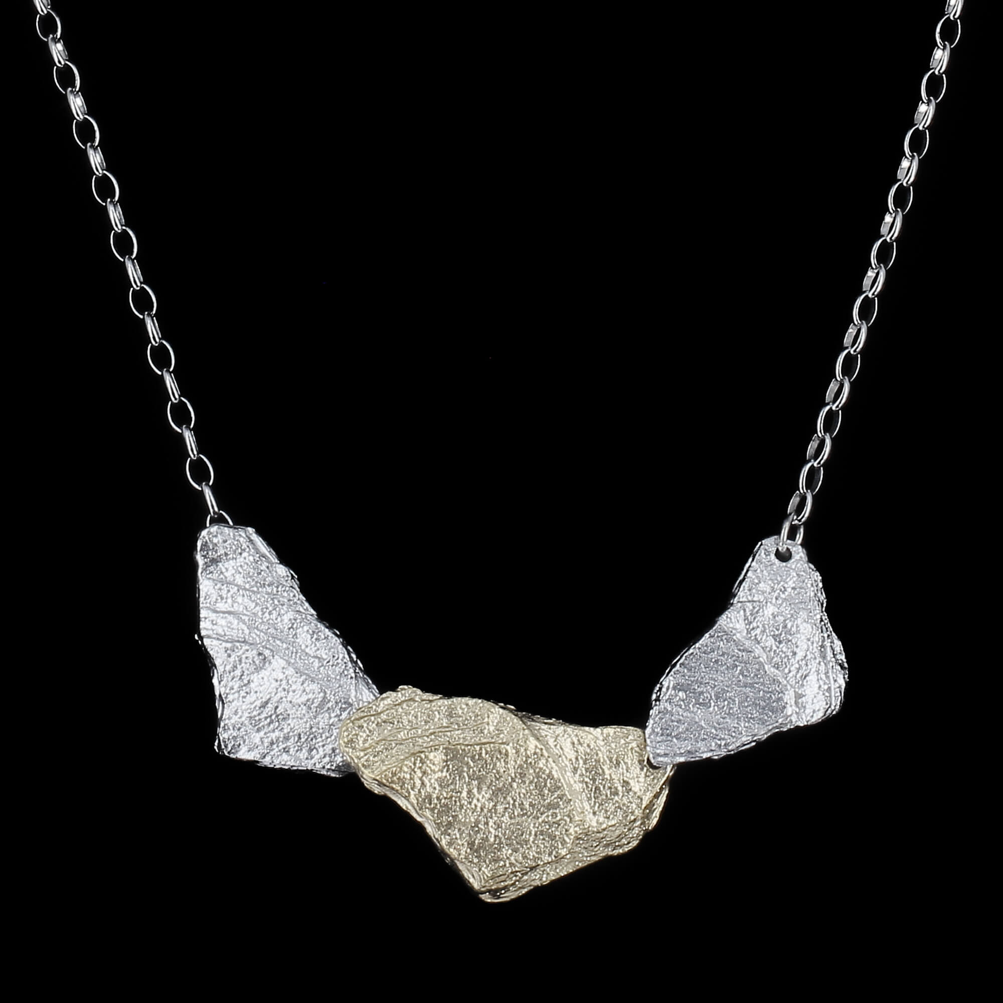 Two silver-colored stone shaped pendant with chain