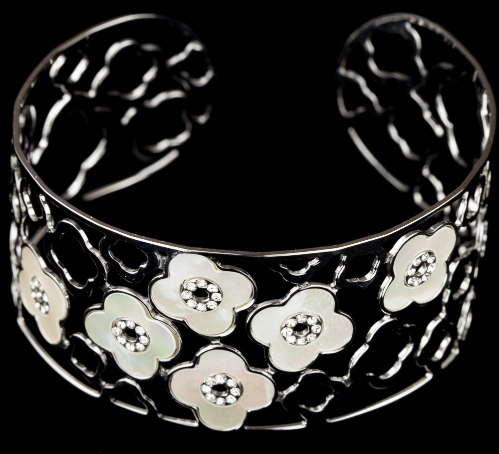 Silver cuff bracelet with mother-of-pearl flower design