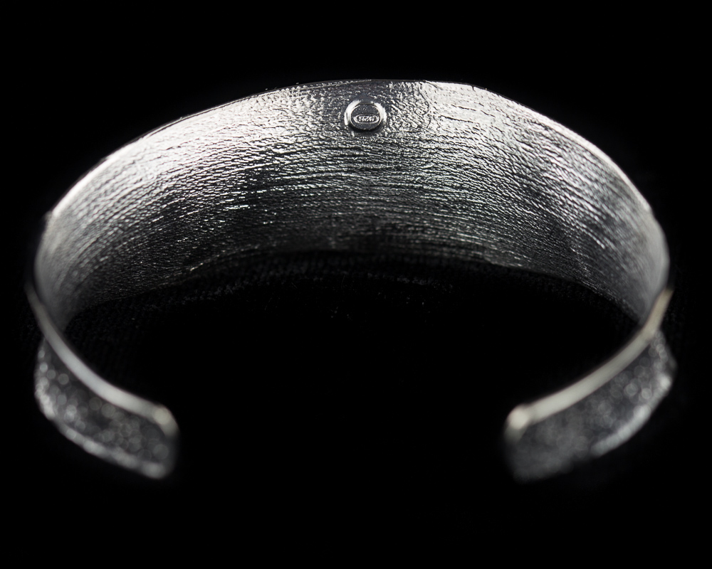 Thin gray silver bangle with flare