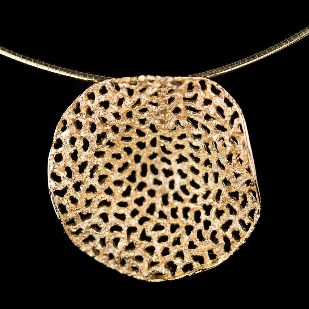 Gold plated pendant with holes and sparkles without chain