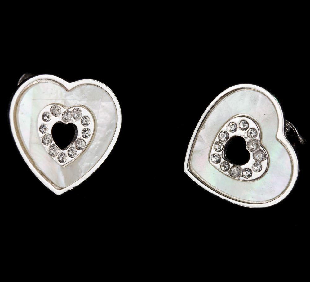 Silver heart shaped studs with mother of pearl