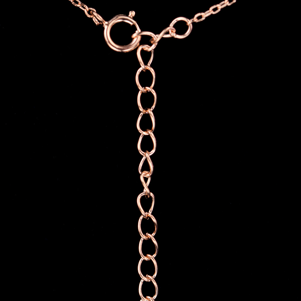 Rose gold necklace with a cross of black zirconia stones