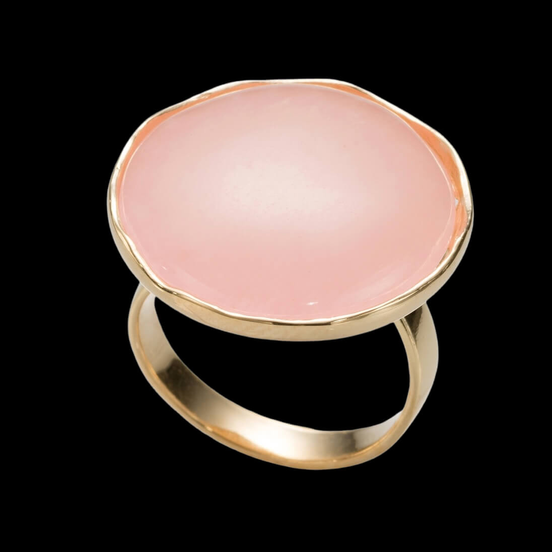 Gold plated ring with a large coral-colored quartz stone