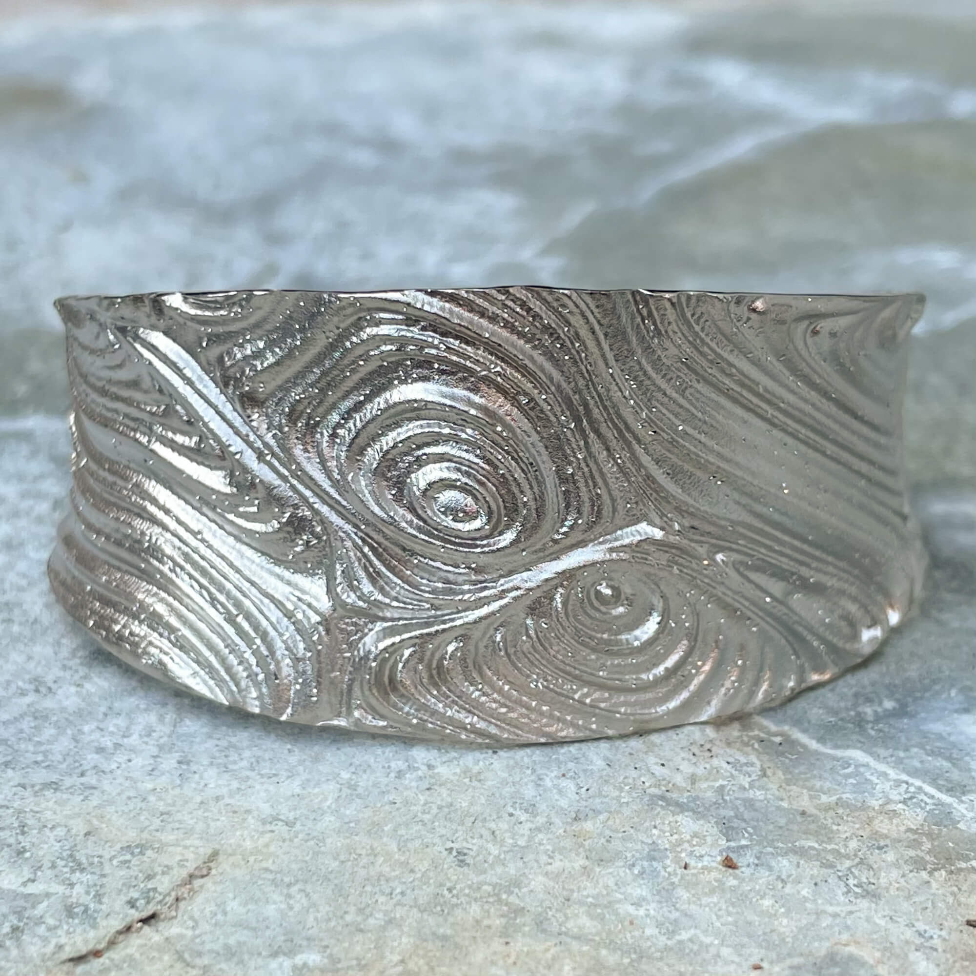 Silver and edited wide slave bracelet