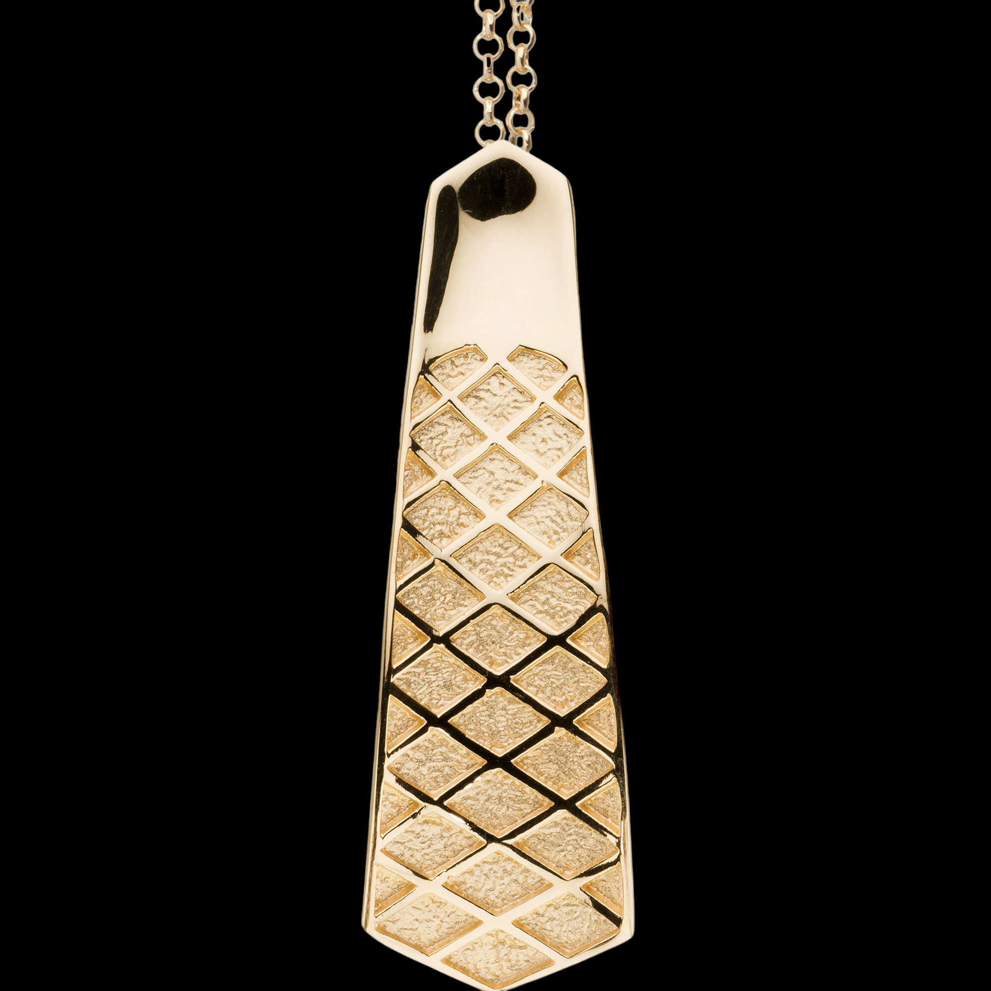 Gilded checkered pendant of matt polished silver