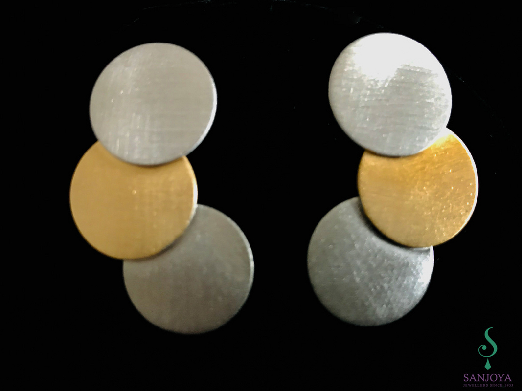 Three colored silver earrings with circles