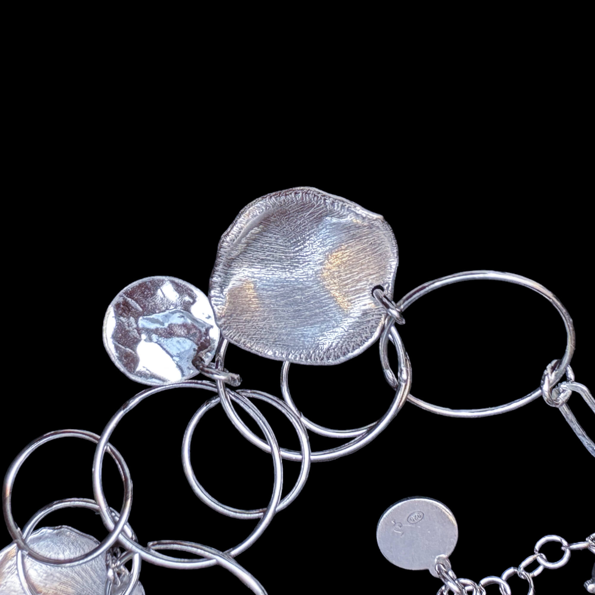 Open and closed round silver link bracelet