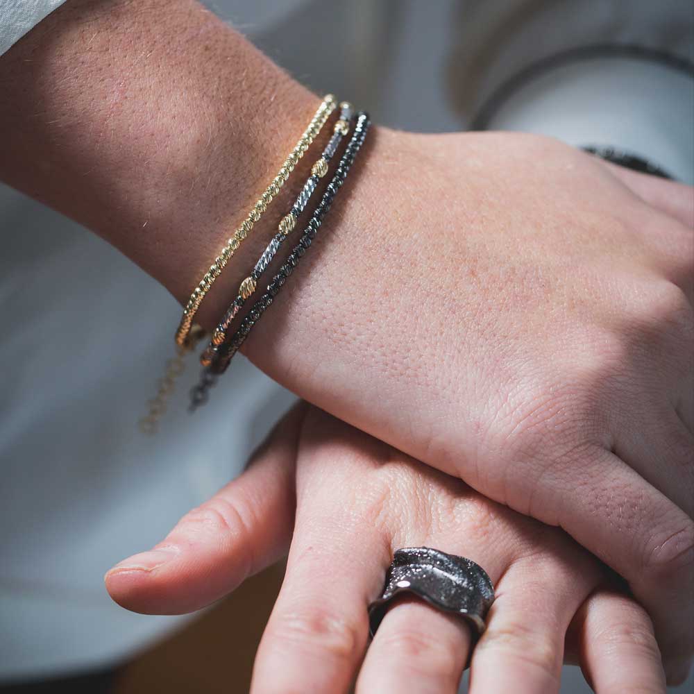 Italian three-colored bracelet in gold, black and silver