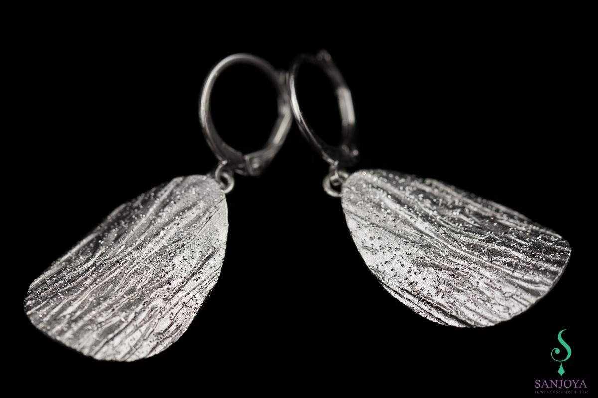 Silver dependent and oval diamanted earrings