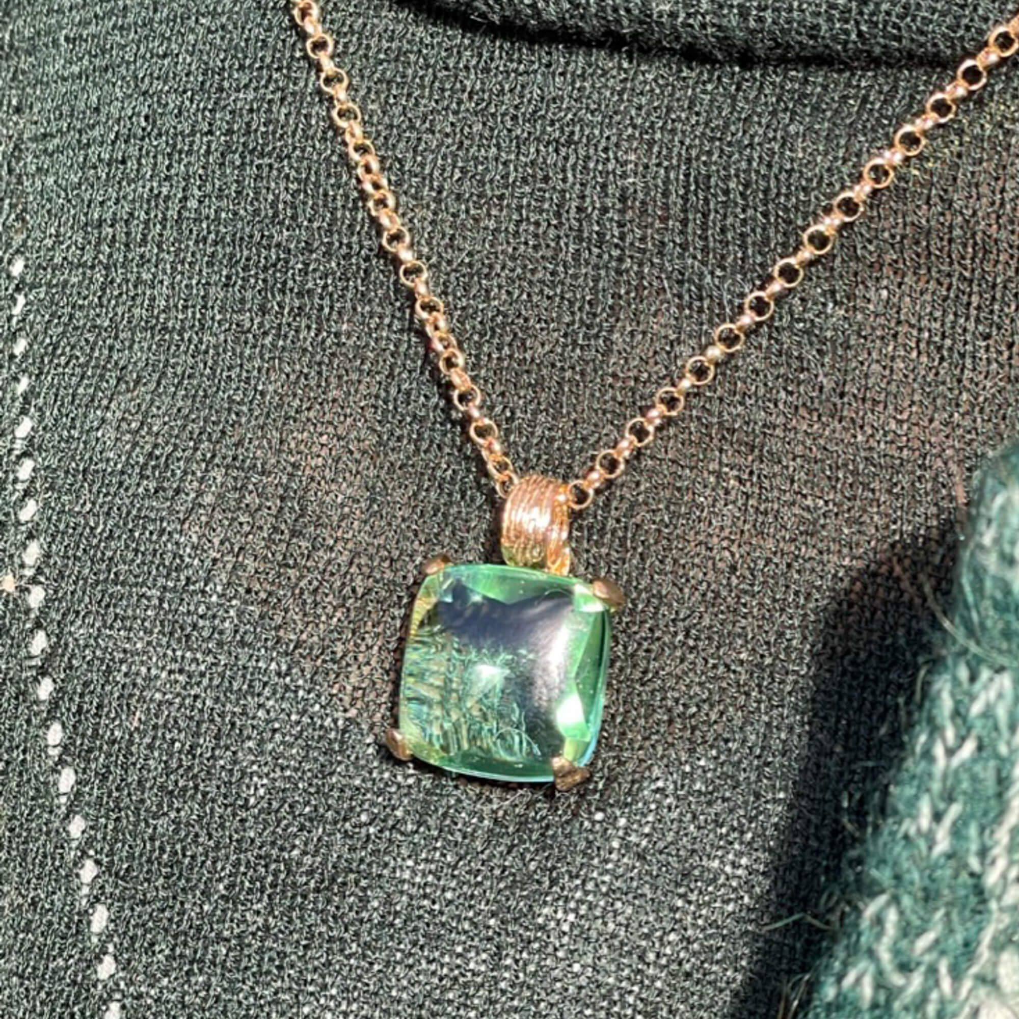 Green square-shaped pendant with gold-plated chain