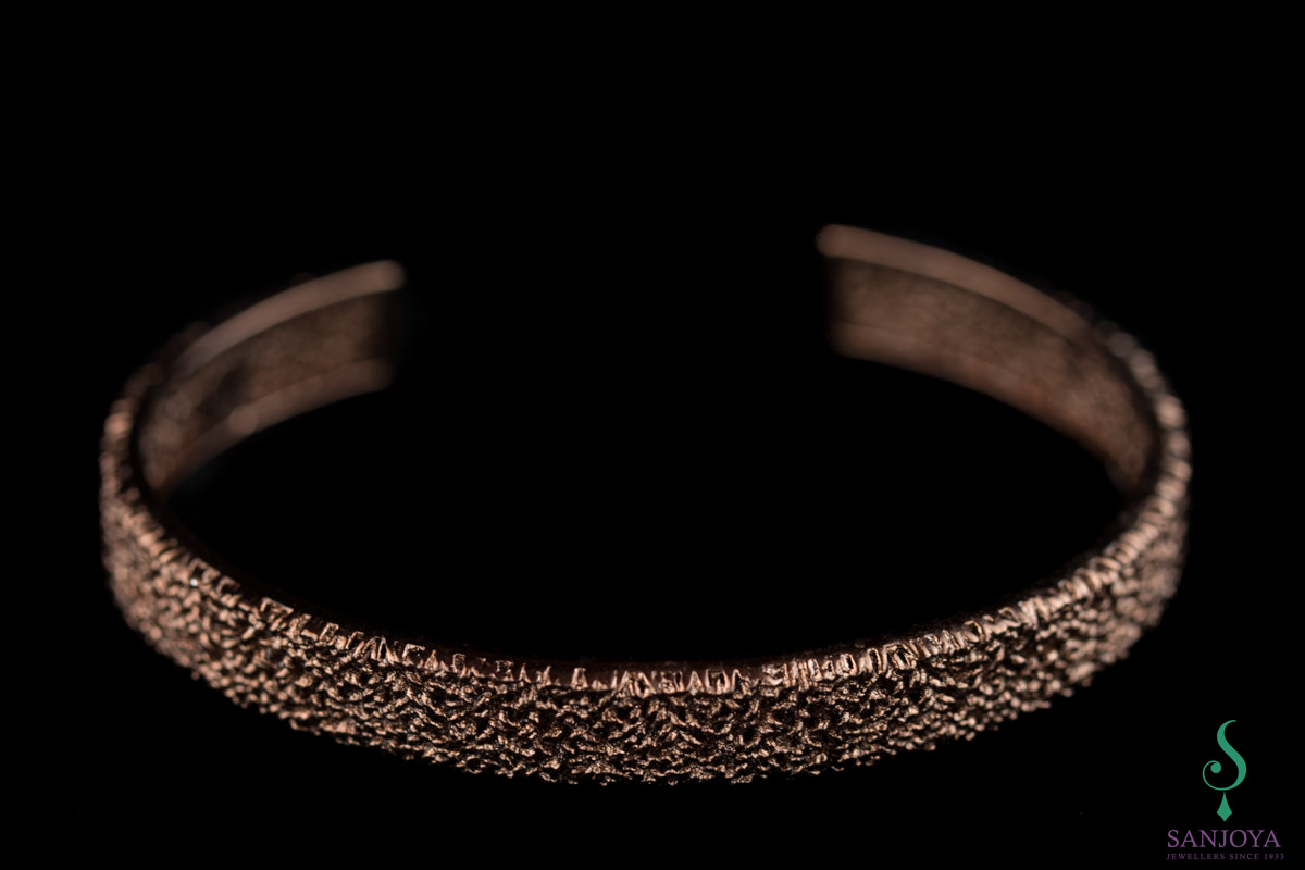 Opened cuff bracelet of brown silver