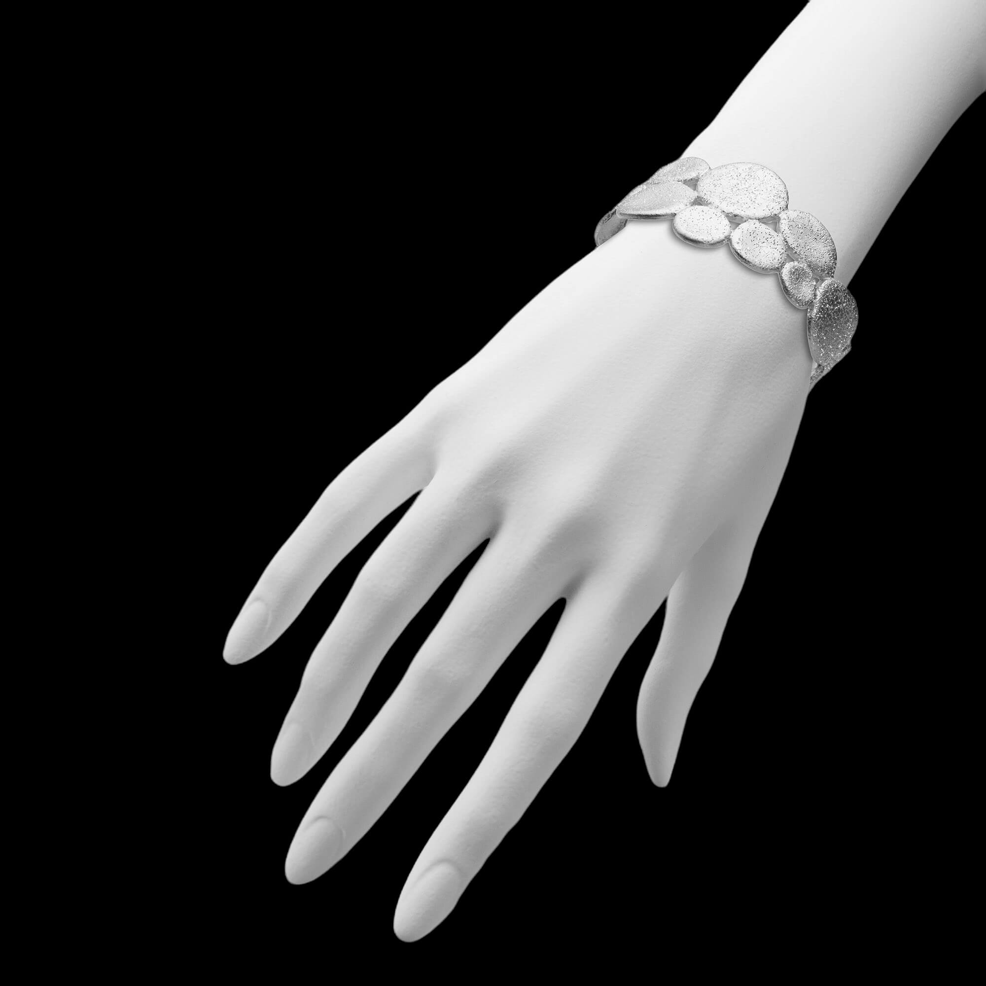 Beautiful silver bangle with decorated ovals