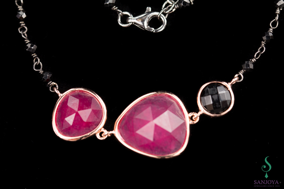 OX1118002 - Zwarte armband met fuchsia stenen en rosé randje