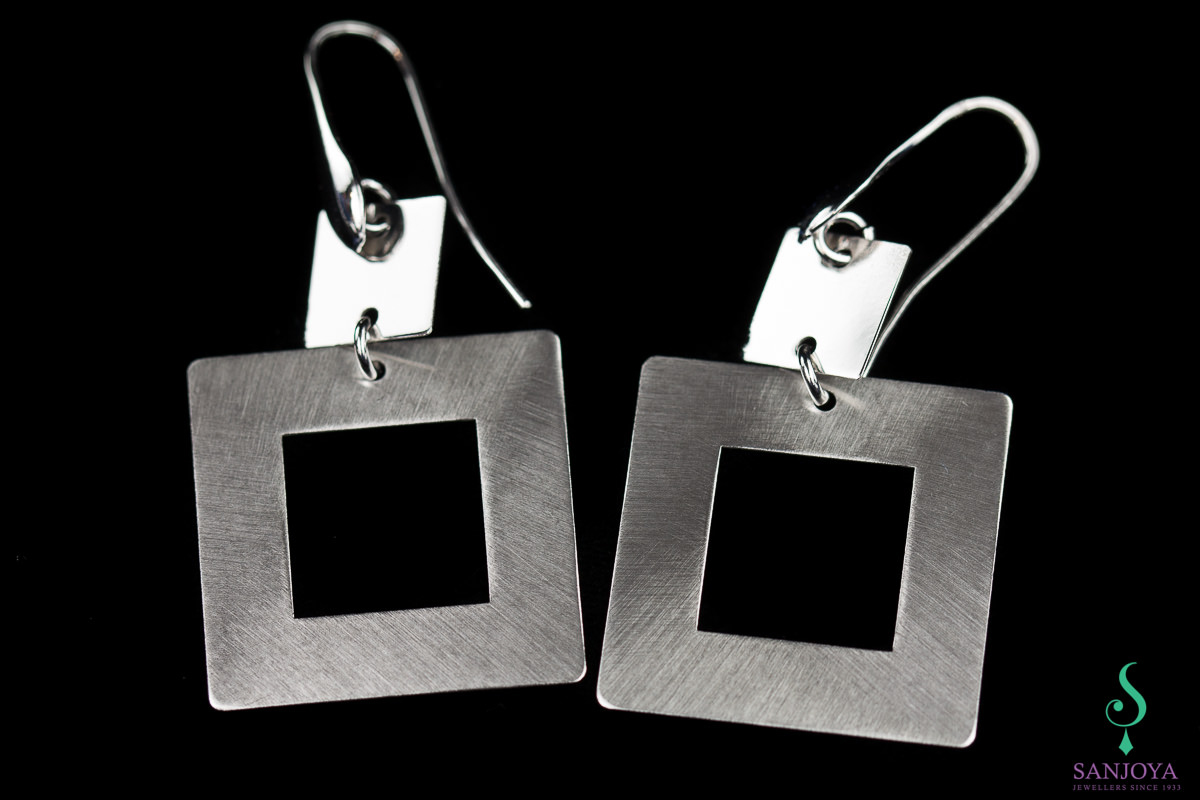 Silver earrings. drooping and square