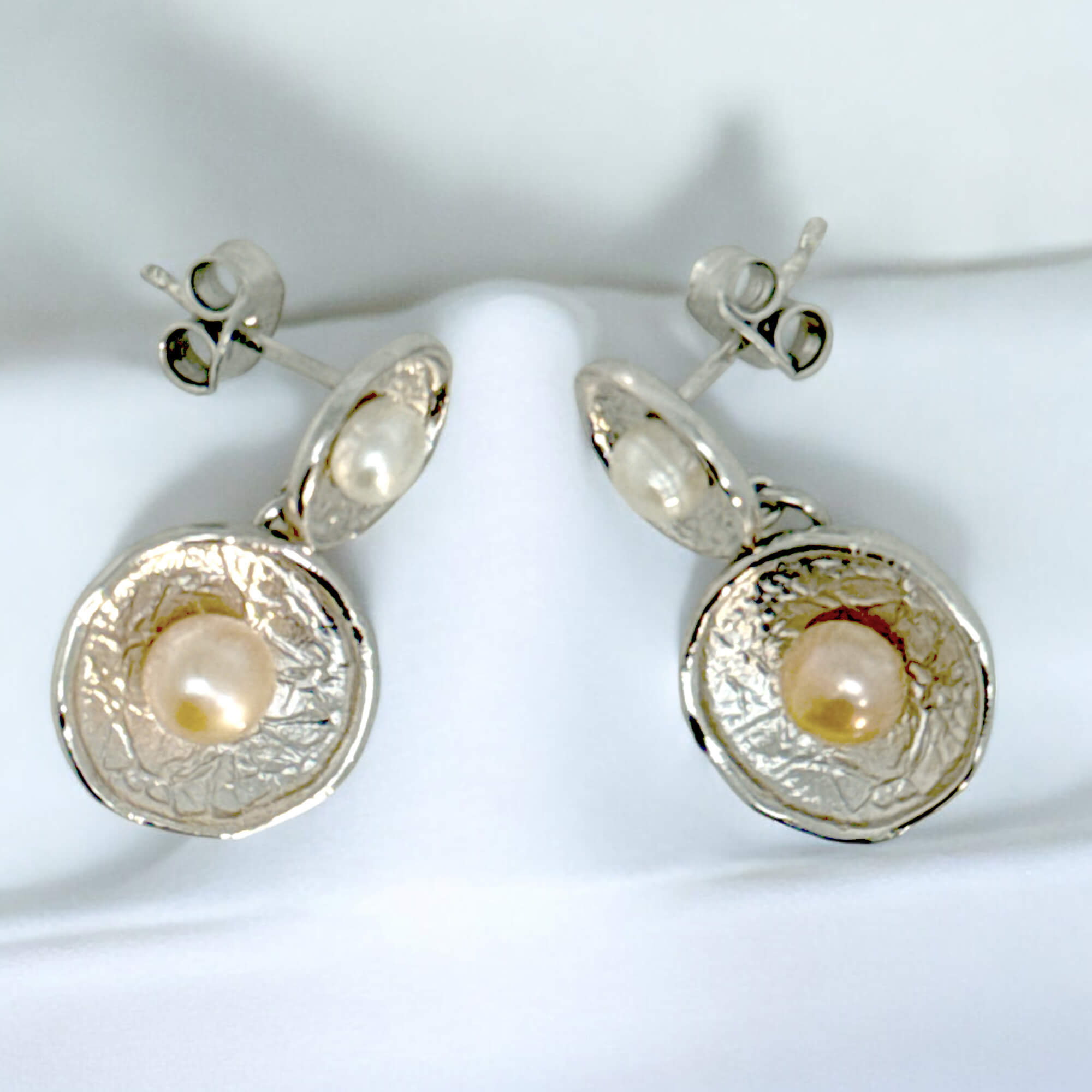 Short hanging silver earrings with two pearls