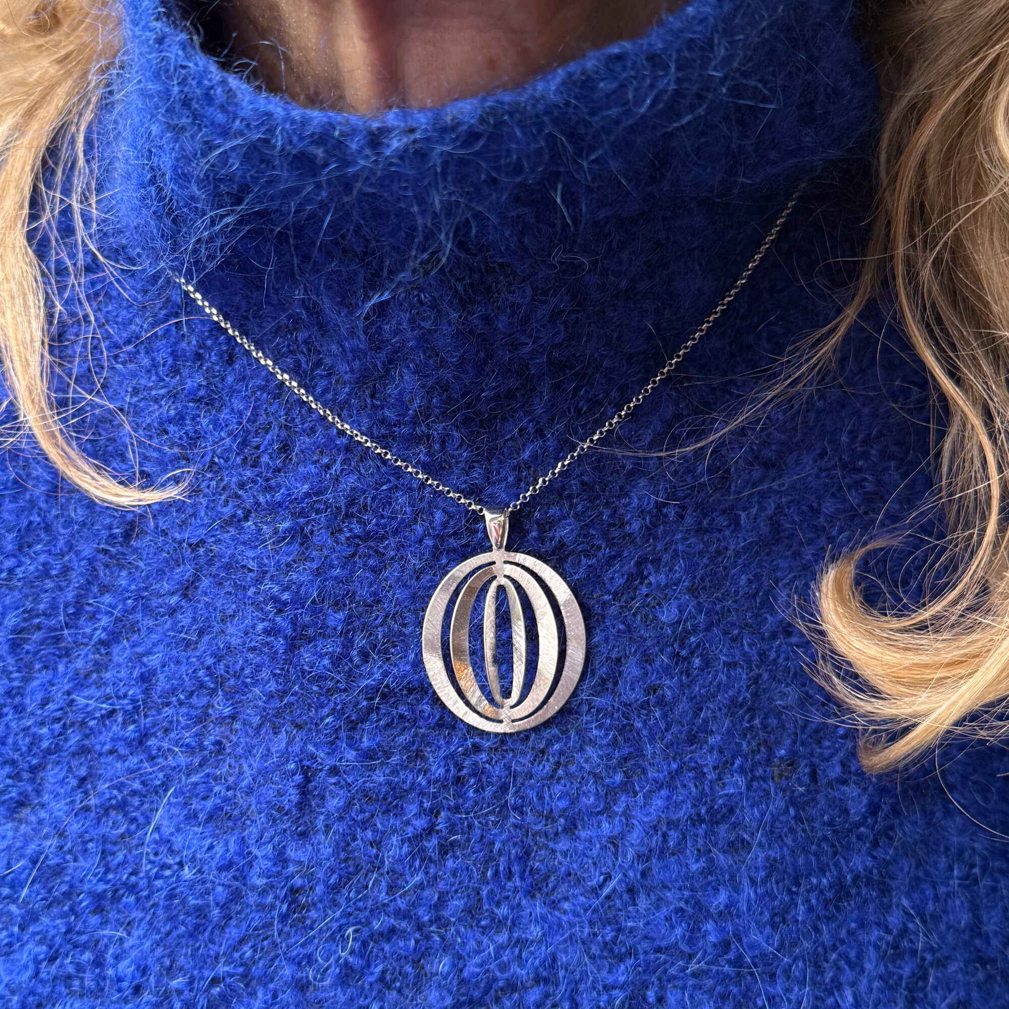 Silver Necklace with an Openwork Pendant