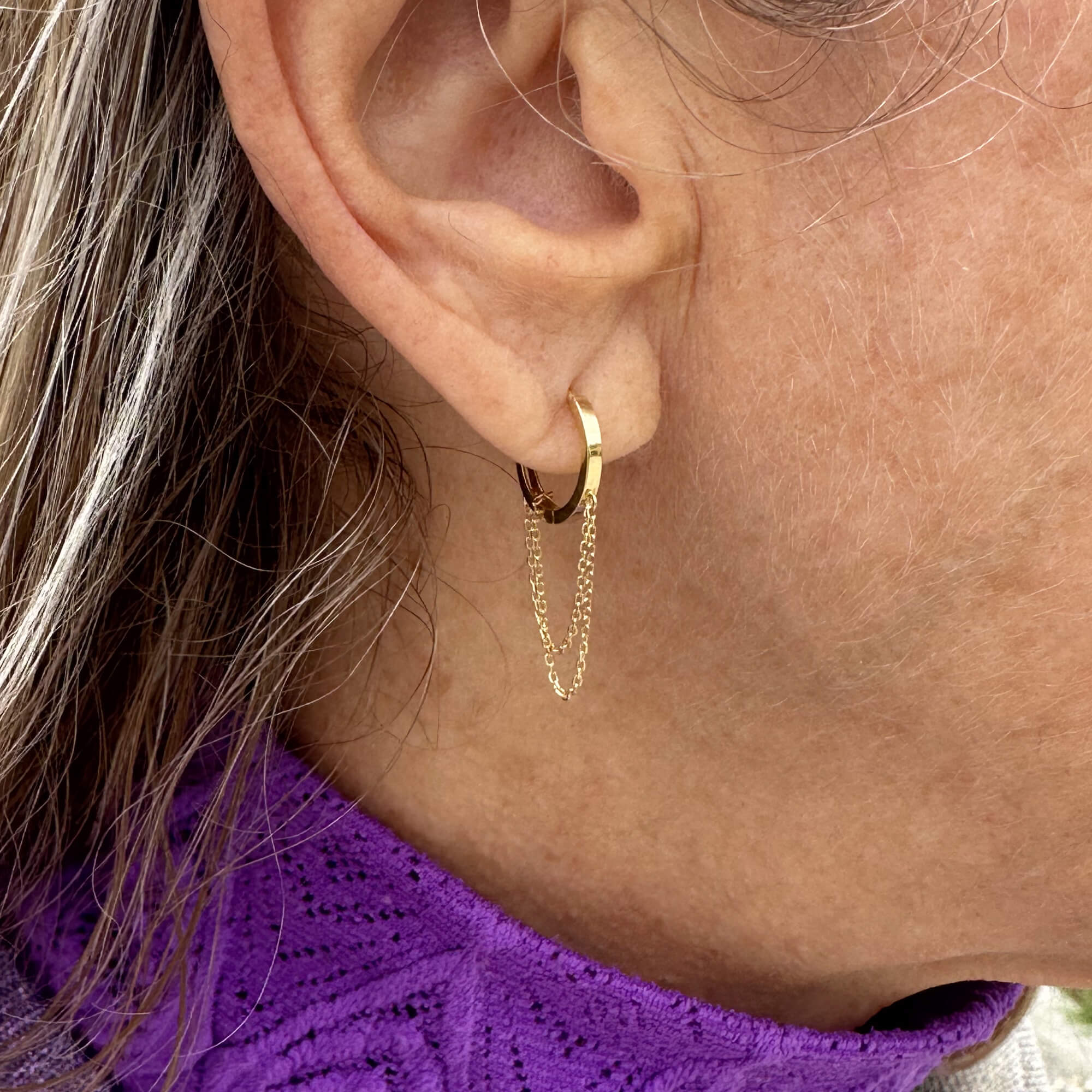 Gold hoop earring with hanging chains