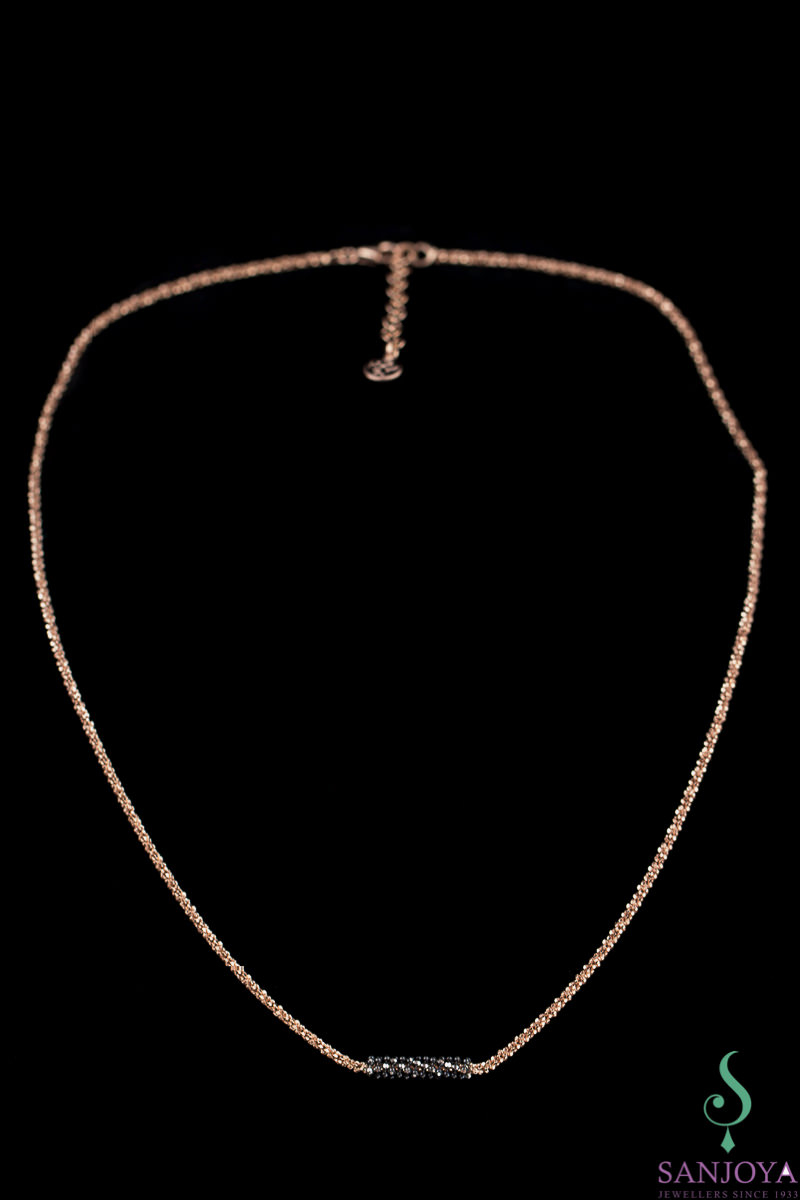 Rose gold necklace with black sparkling pendant