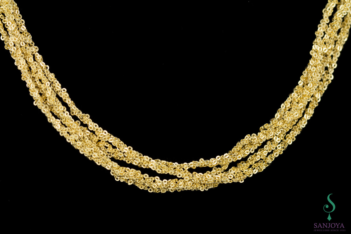 Four interwoven chains of gold plated silver