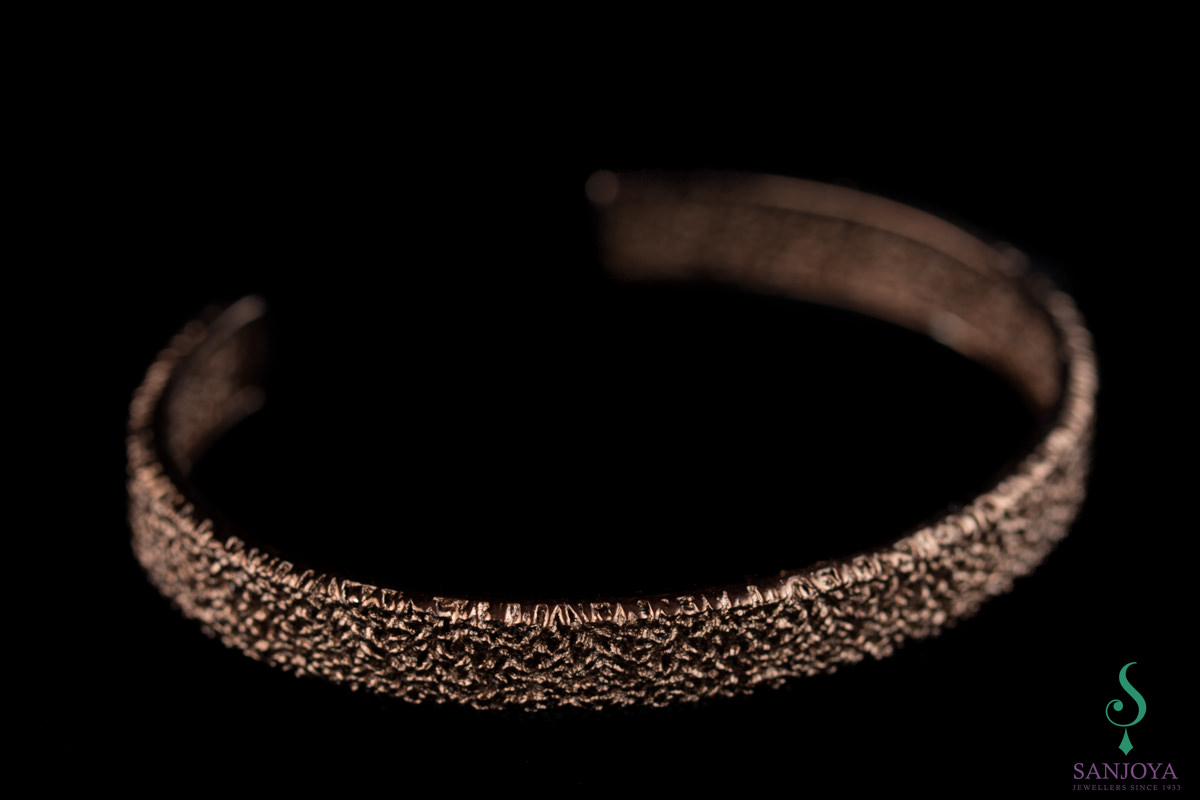 Opened cuff bracelet of brown silver