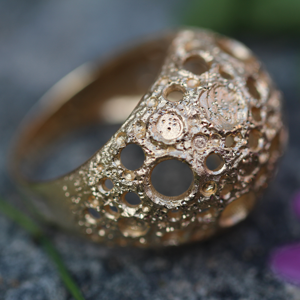 Processed and gold-plated spherical ring