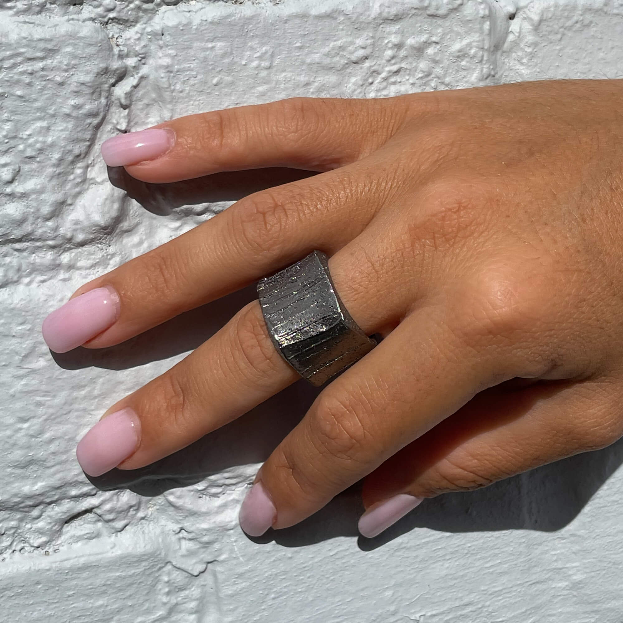 Silver-gray ring square-shaped and diamond-plated