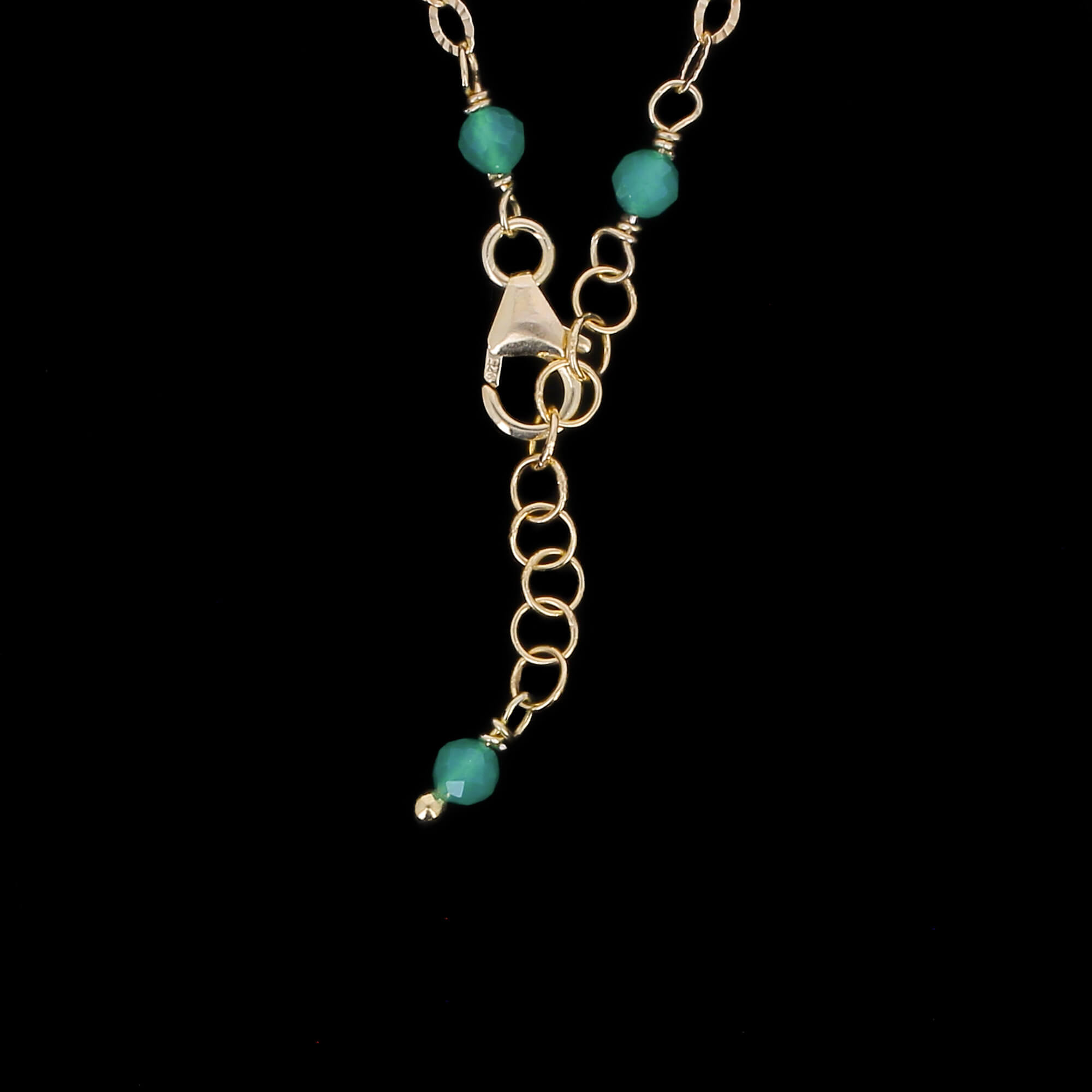 Short chain plated with green gemstones
