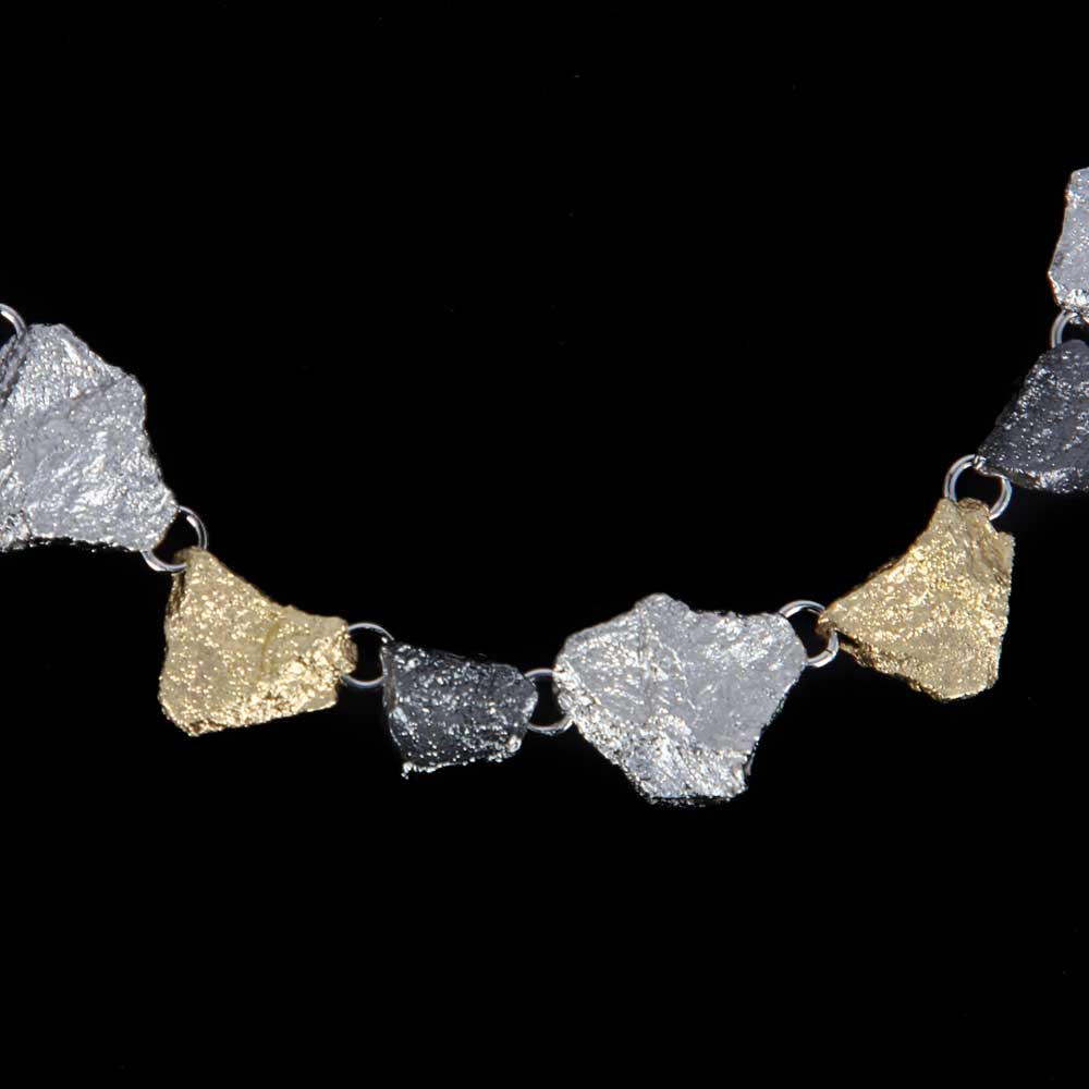 Beautiful stone-shaped three-colored silver necklace