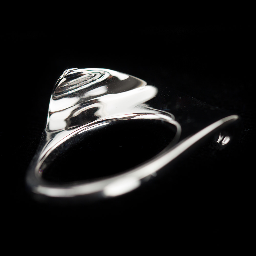 Silver polished ring with an irregular shape