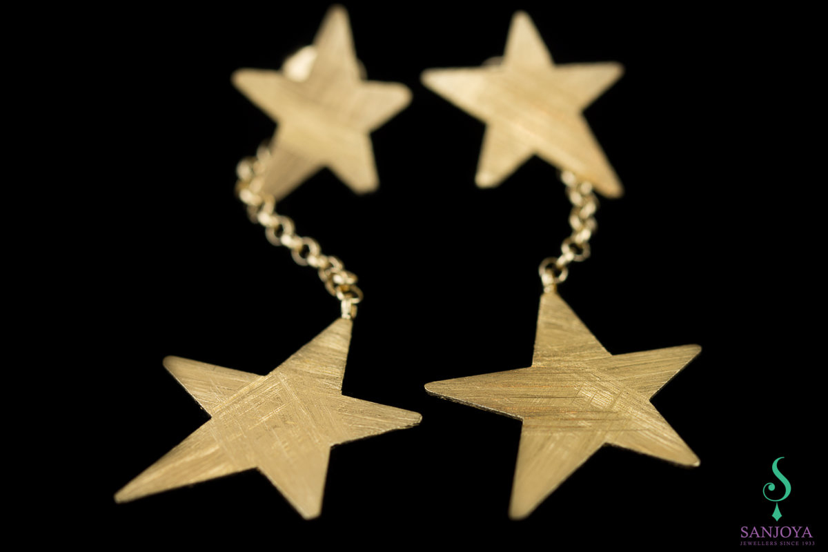 Long gold plated earrings with matte stars