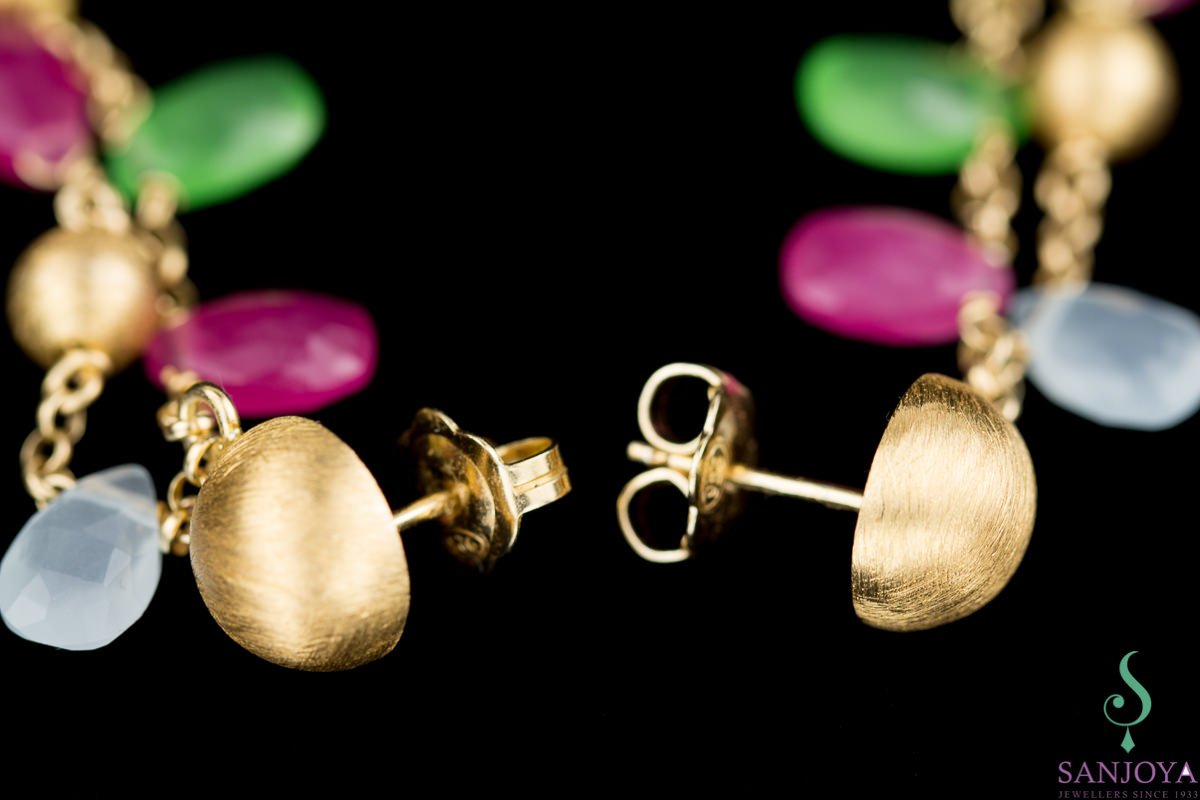 Long gold earrings with colored stones with plug