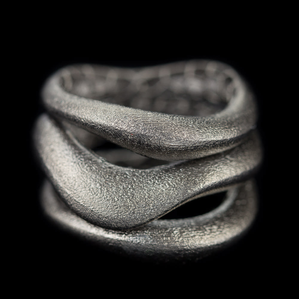 Separate matte ring consisting of three connected rings of dark gray sterling silver. Trendy ring fitting with many jewelry. Also available in the gold-plated, silver and in a tricolor variant. From the Sanjoya collection