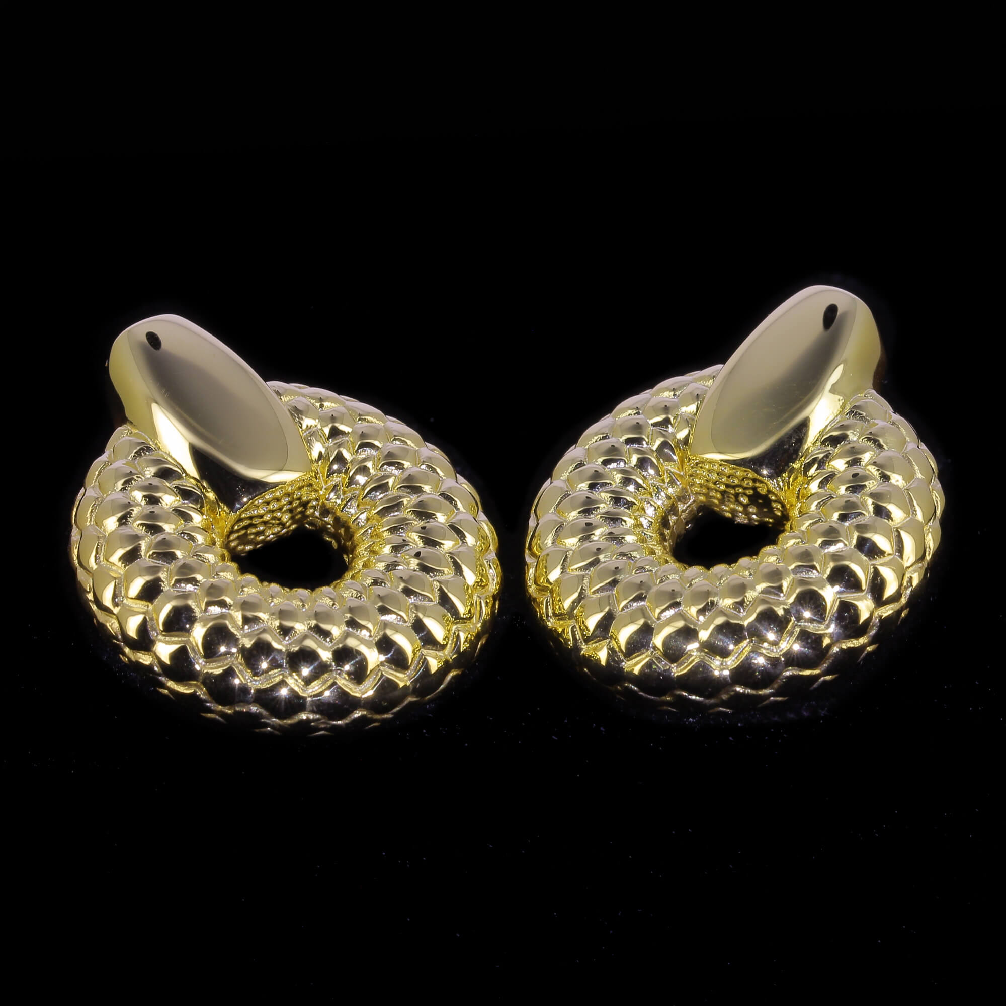 Crafted gold plated and round earrings