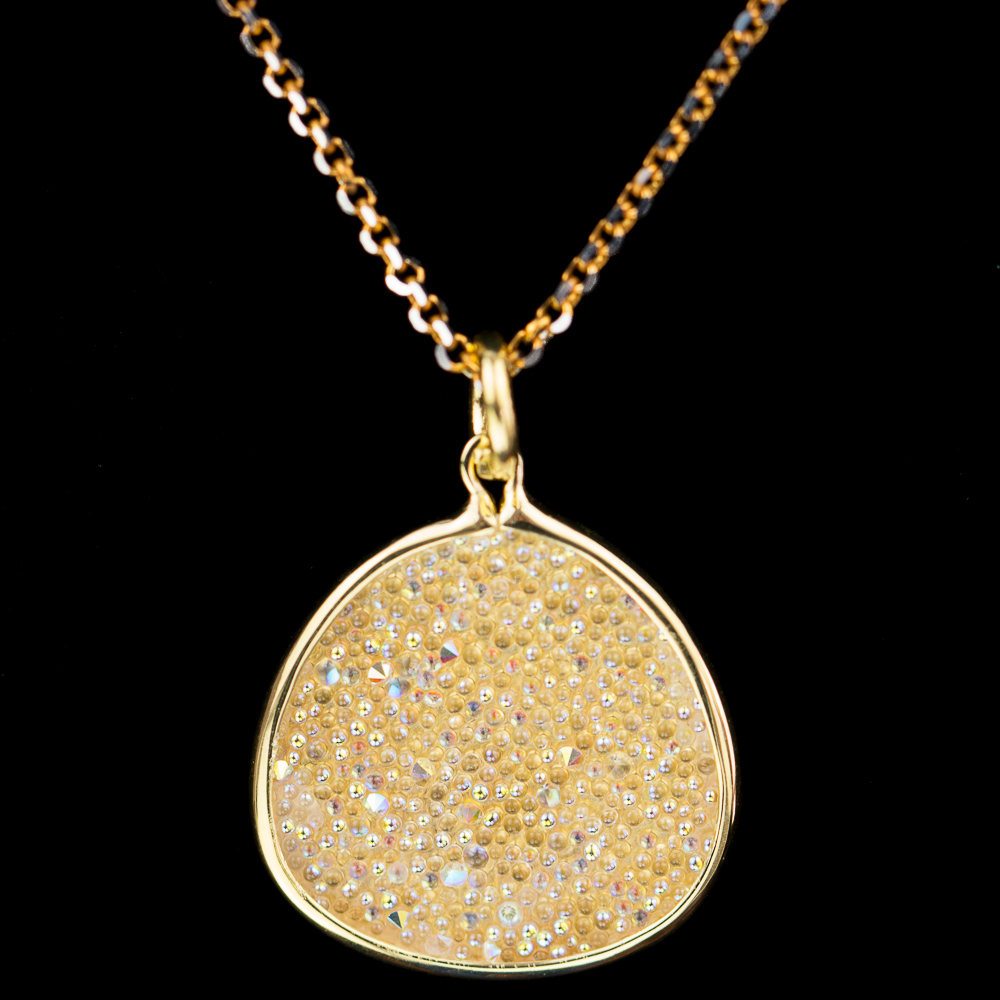 Gold plated necklace with oval pendant of white crystals