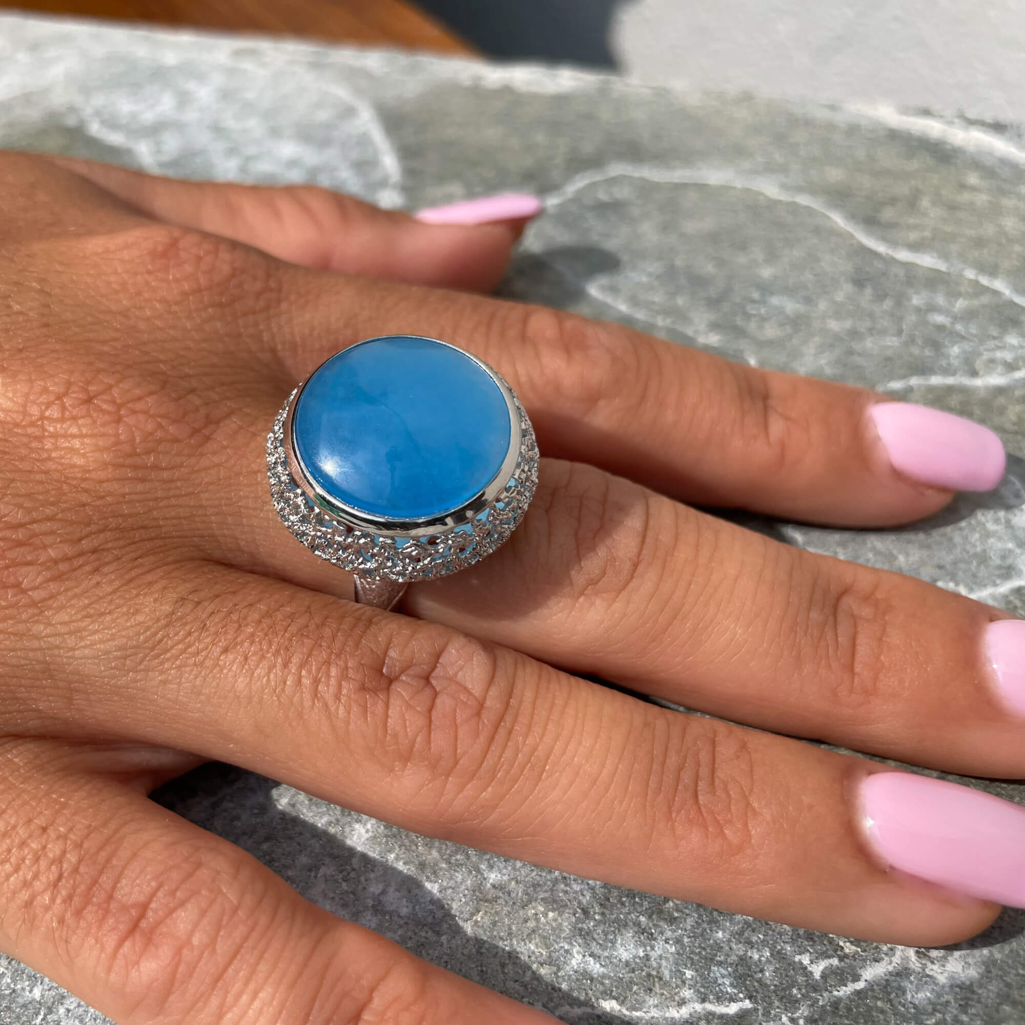 Worked silver ring with a blue quartz stone
