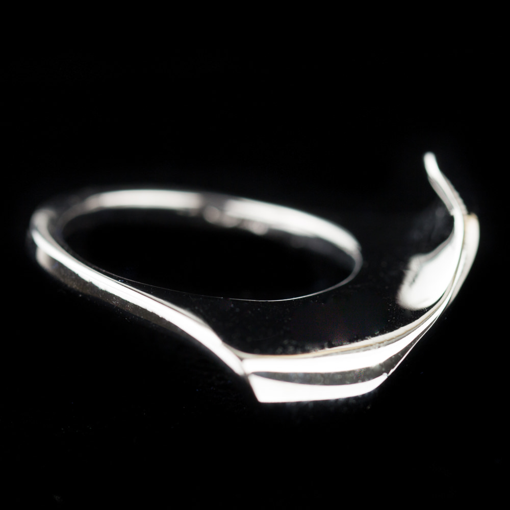 Silver polished ring with an irregular shape
