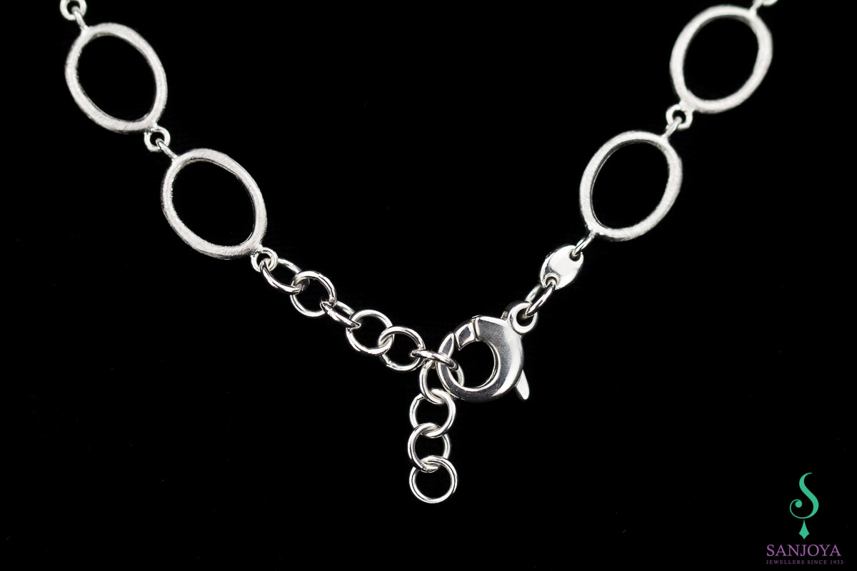 Processed silver necklace with colored stones