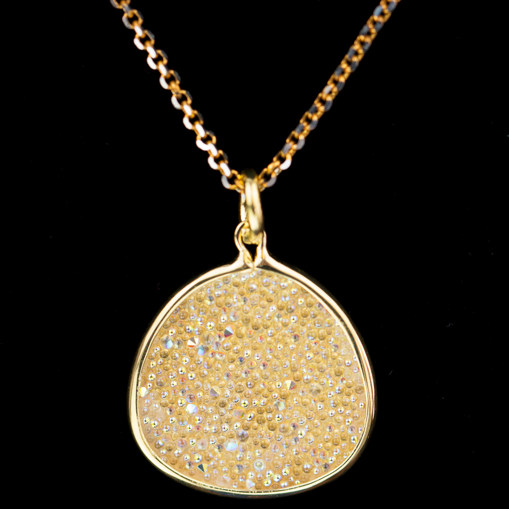 Gold plated necklace with oval pendant of white crystals