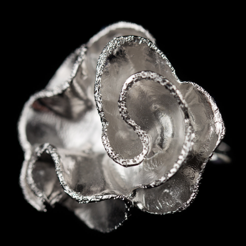 Large silver flower ring, curl-shaped and diamond-plated