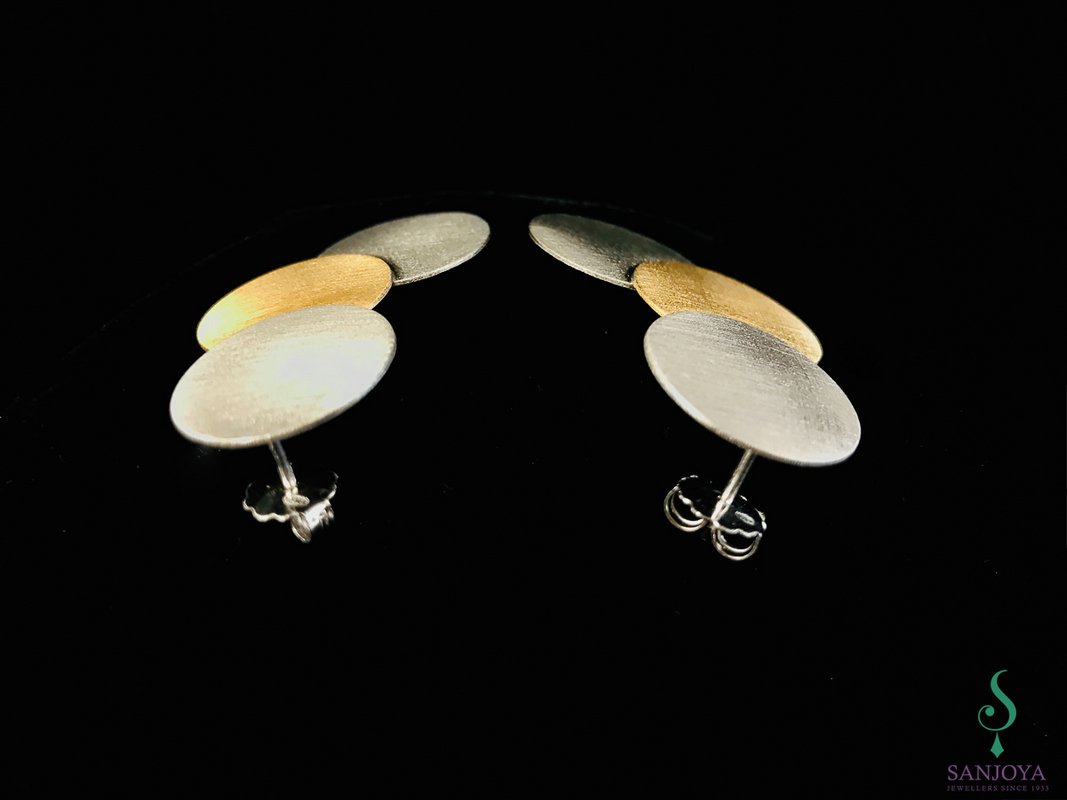 Three colored silver earrings with circles