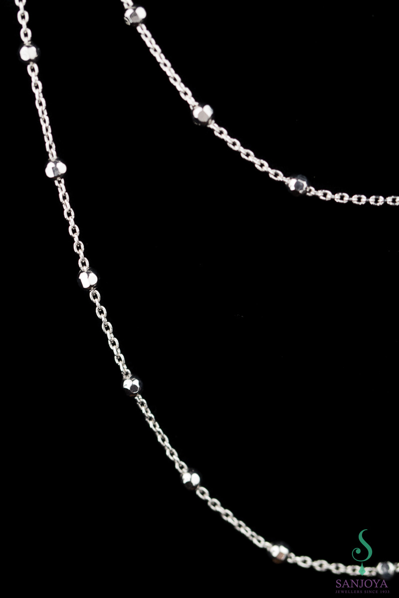 Long necklace with some small glittering balls