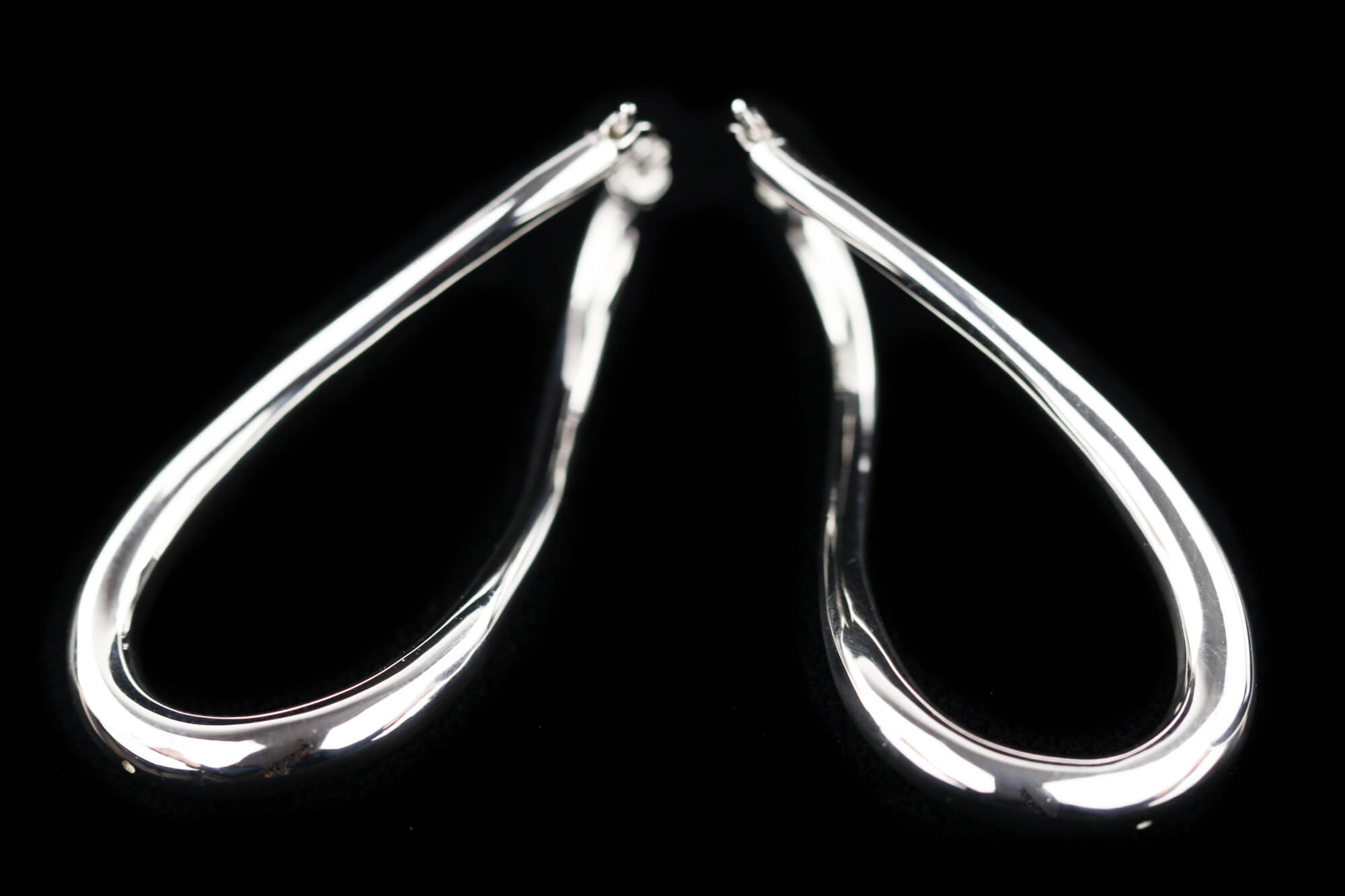 Silver and polished Infinity Creoles. Sanjoya